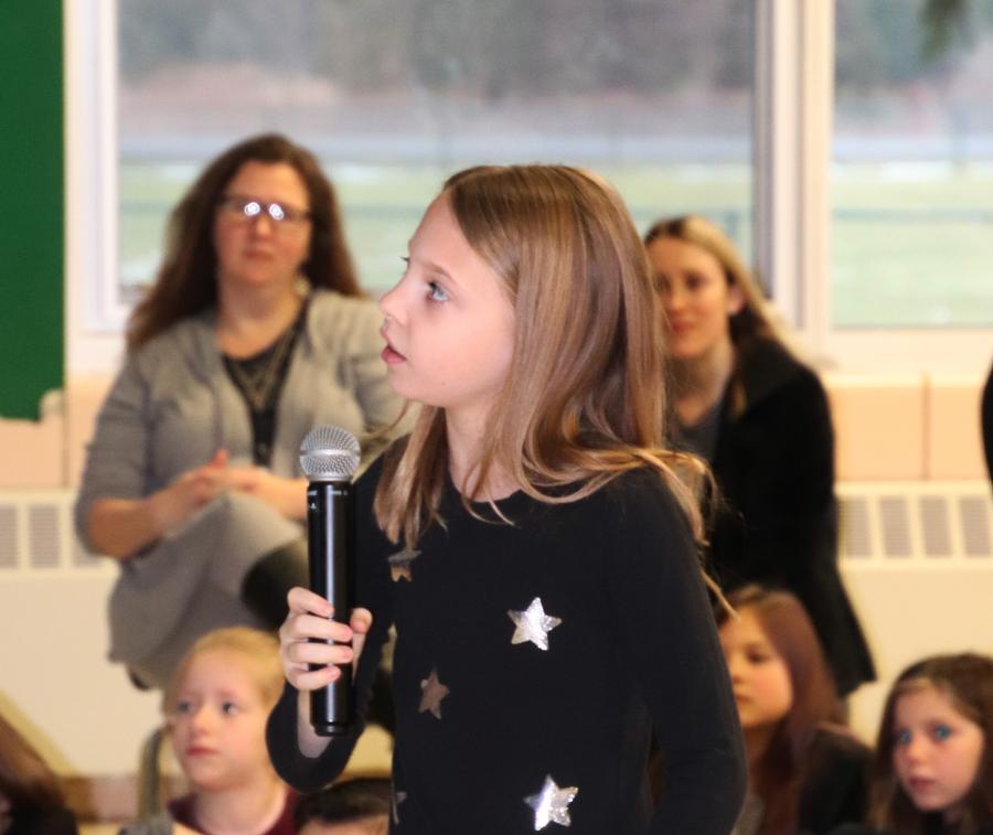 photo of girl holding microphone