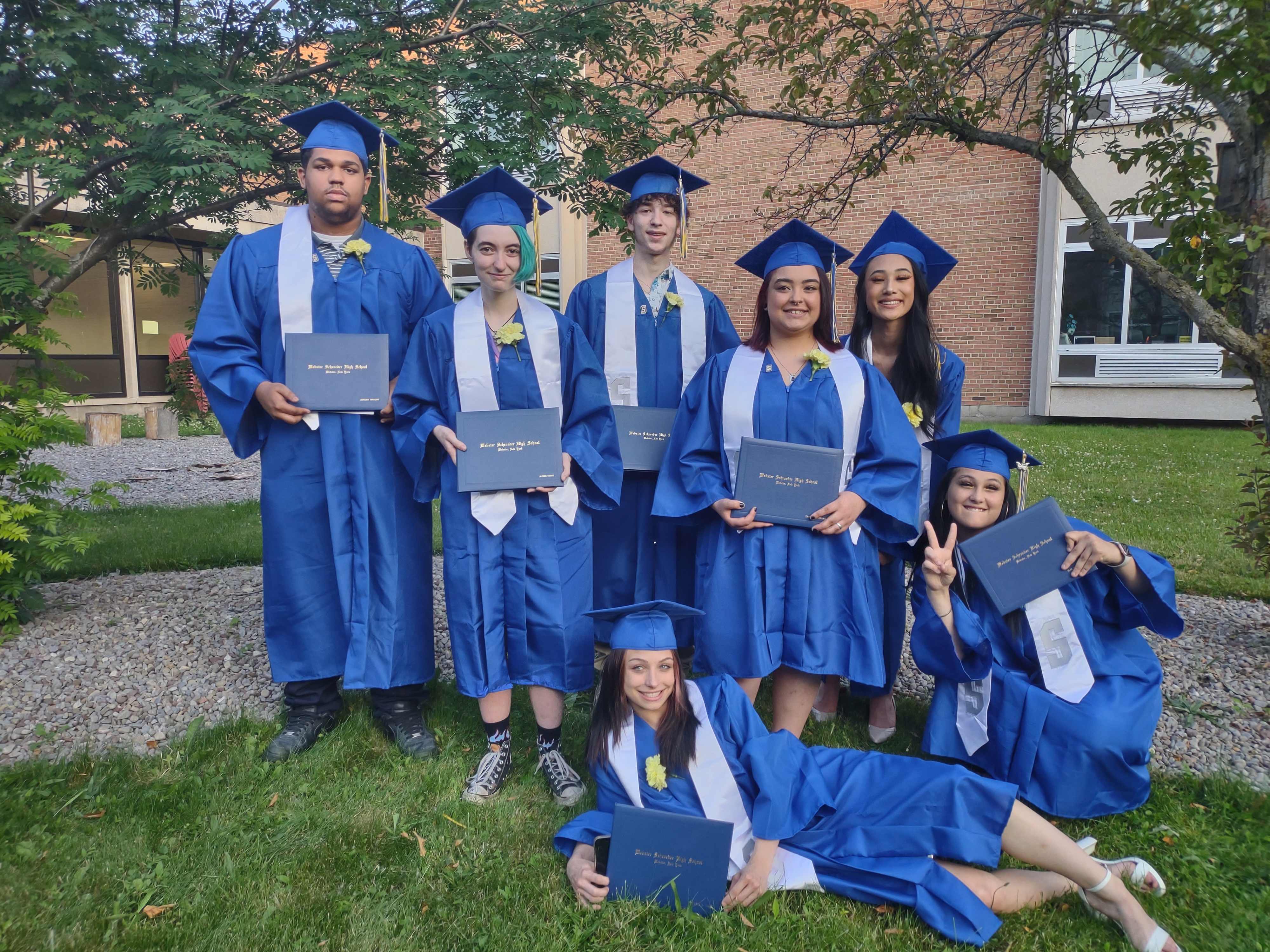 GOAL Seniors in their blue caps and gowns after graduation ceremony