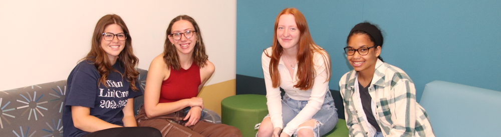 Group of teenage girls sitting together.