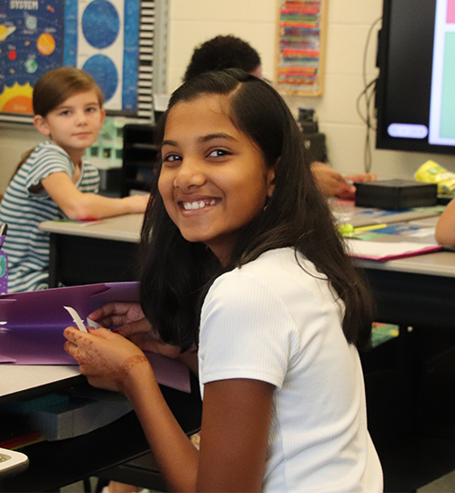 Girl doing classwork. 