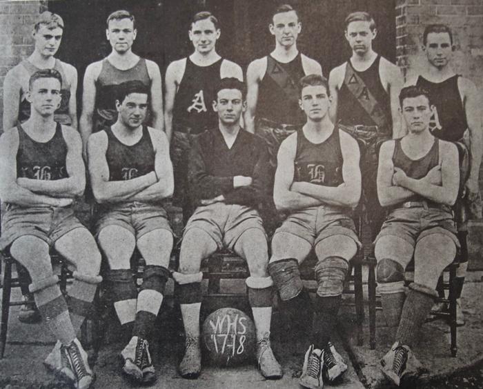 11 young men dressing in shorts and tanktops.