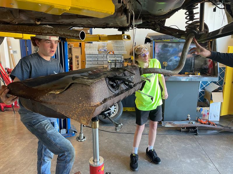 Thomas auto tech students at work on the wagon.