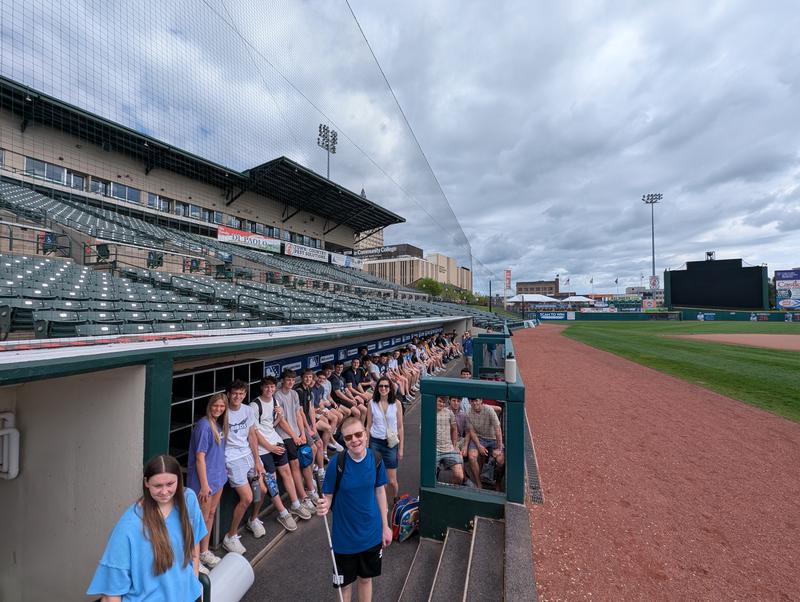 Teens in a baseball dugout
