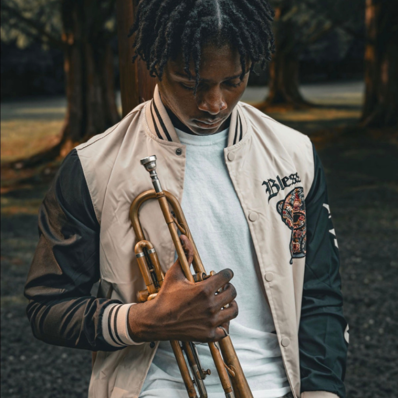 Photo of teen holding trumpet