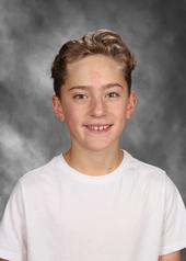 Boy in white shirt smiling