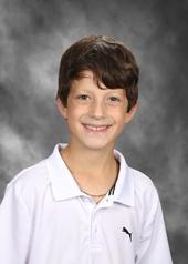 Boy in white shirt smiling