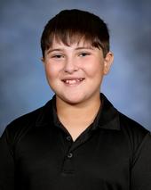 Boy in black shirt smiling