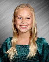 Girl in green smiling