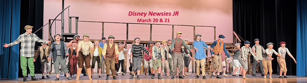 A lineup of middle school kids dressed as newsies from 1899. 