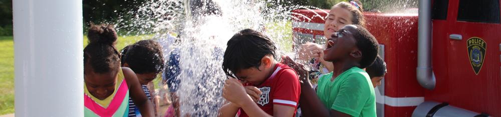 photo of kids playing in spary park